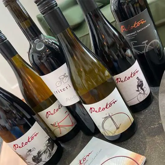 A group of bottles of wine on a table.